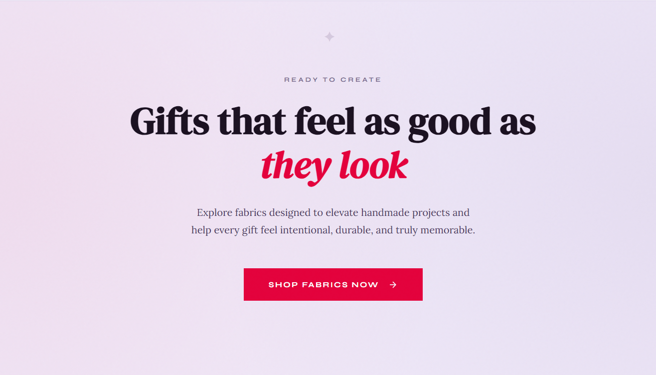 Centered text on a pink gradient background reads: "Gifts that feel as good as they look." Below is text about handmade fabrics, and a pink button labeled "Shop Fabrics Now" with a right arrow.